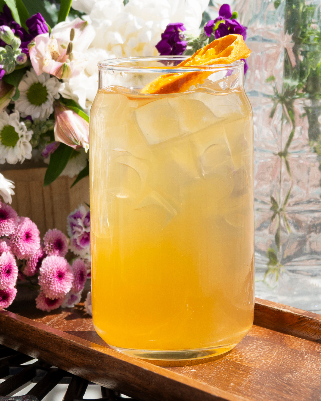 Citrus MerTail in a glass over ice