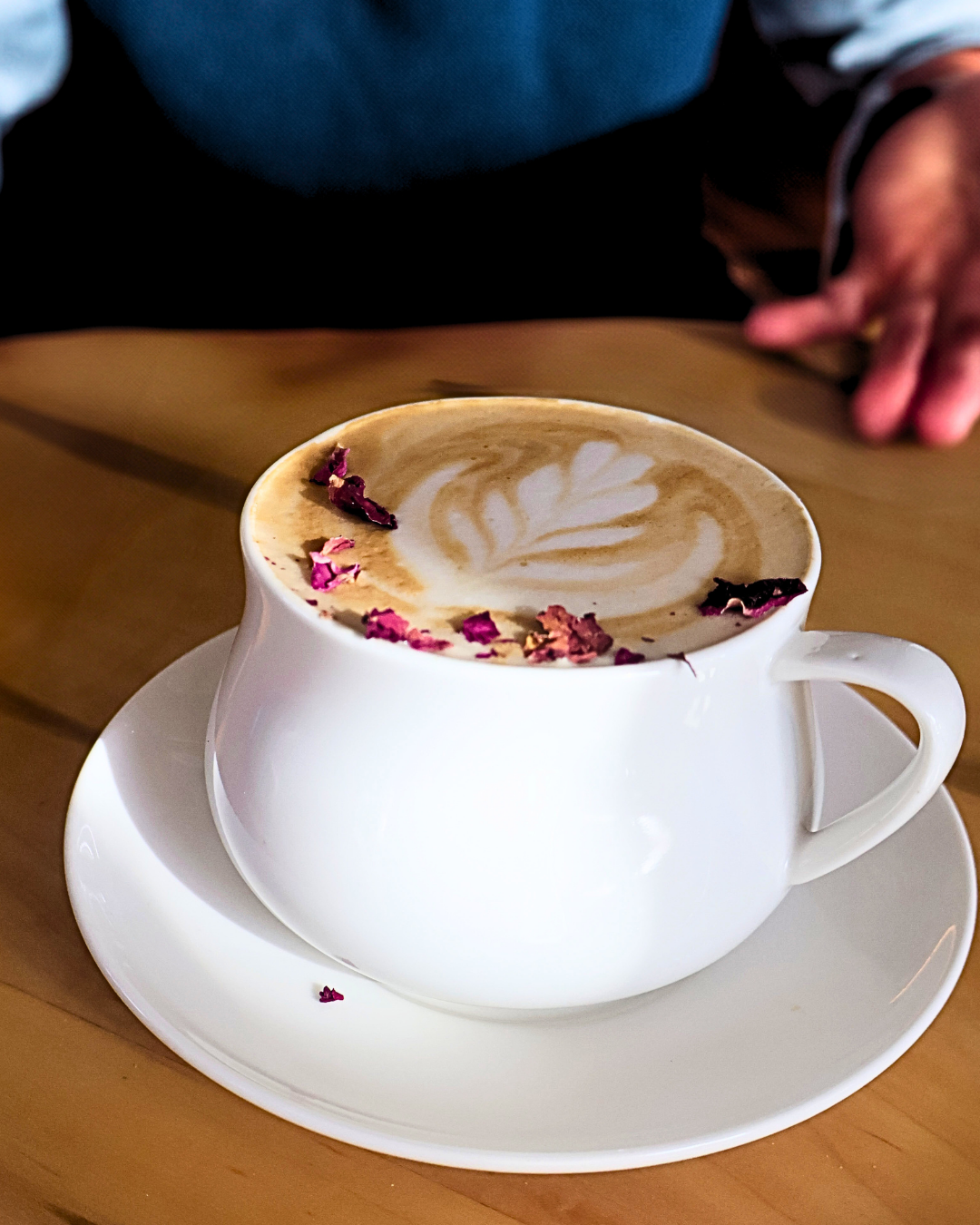 Rose petal latte in a white cup