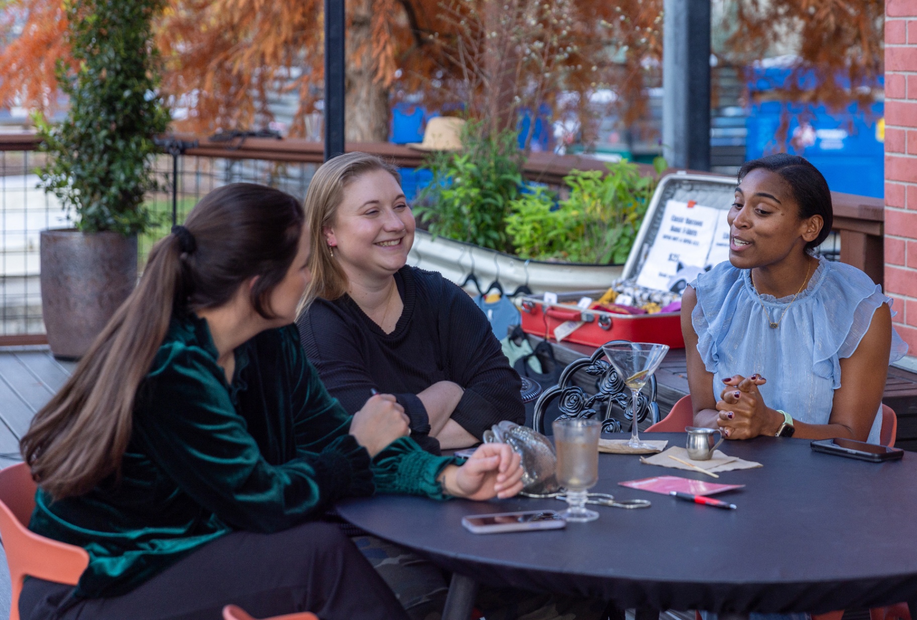 Friends gathering on the patio, Plant Bar West Asheville