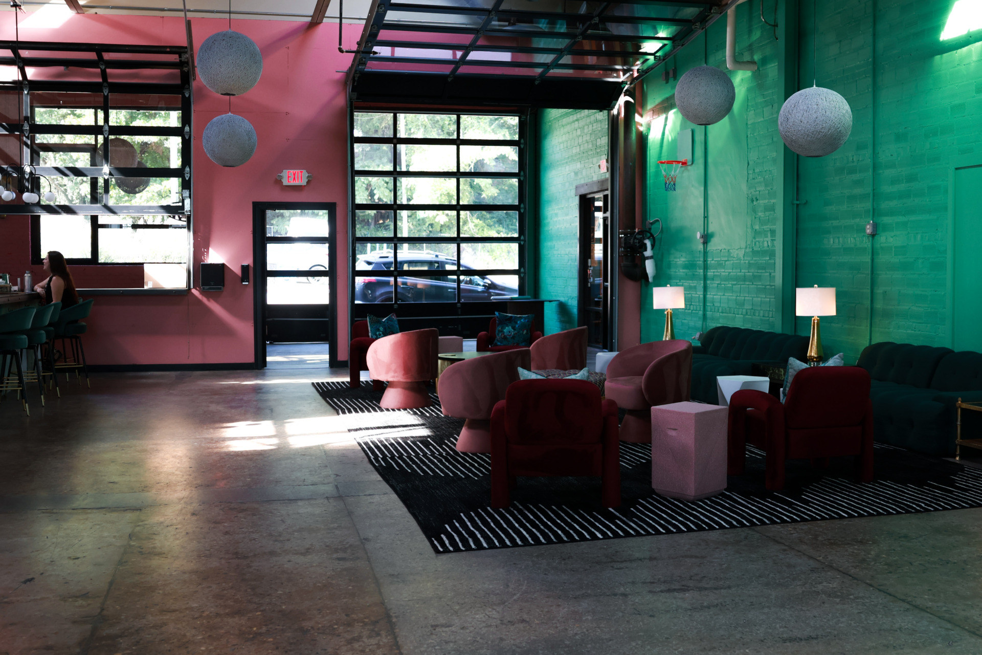Plant Bar social lounge with modern seating and vibrant design in Asheville’s South Slope District.